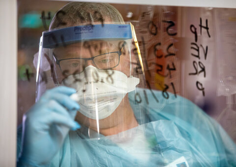 Respiratory Therapist writing on board